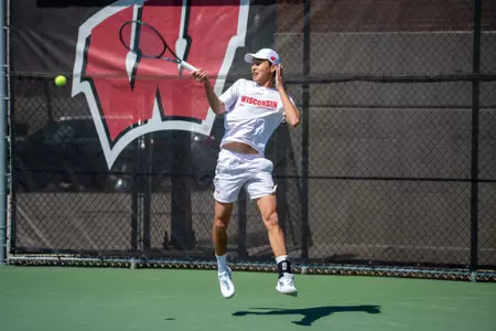 Edouard Aubert returns a serve