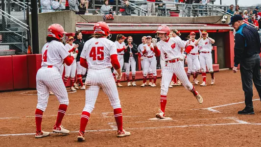 Dani Lucey crosses the plate after homering against Indiana
