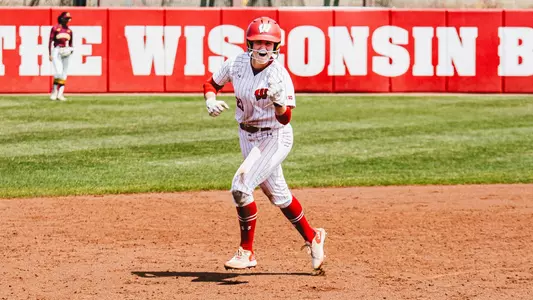 Ellie Hubbard rounds second base after hitting a go-ahead home run against Minnesota