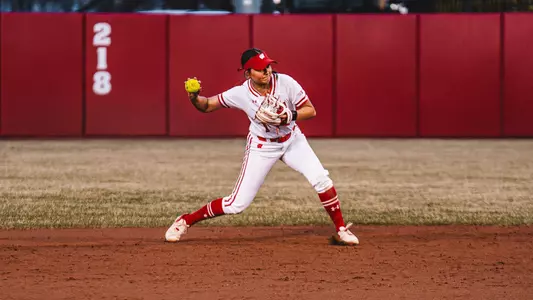 Kaylie Whidden throws out a runner against Iowa