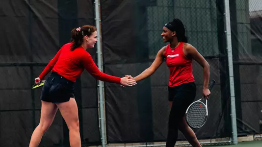 Johnson and Sholokhova celebrate a point