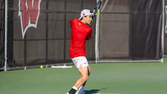 Matthew Fullerton returns a shot