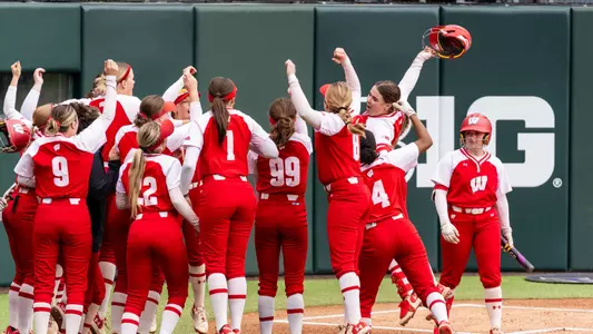 Hilary Blomberg celebrates hitting a home run against Washington
