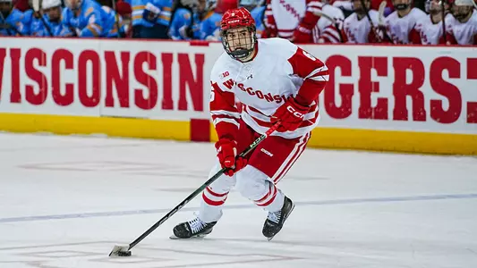 Logan Hensler skates with the puck against LIU