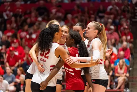 Team White celebrates after a point at the Red & White Scrimmage.
