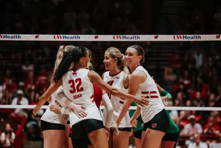 Badgers celebrate after earning a point against Notre Dame in their exhibition match.