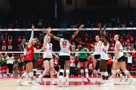 Badgers celebrate after winning a point against Notre Dame in an exhibition match.