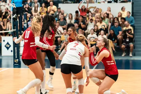 The Badgers celebrate after winning a point against Georgia Tech.