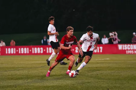 Julian Kuhr dribbles the soccer ball against Maryland