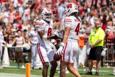 Vinny Anthony II and Jayden Ballard shake during an NCAA college football game against the Alabama Crimson Tide, Sat., Sept. 13, 2025, in Tuscaloosa, Ala. (Photo by David Stluka/Wisconsin Athletic Communications)