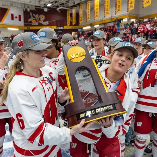 Wisconsin Badgers forward Lacey Eden (6) celebrates with the National Championship Trophy after the NCAA college Women’s Frozen Four Final hockey game against the Ohio State Buckeyes, Sun., Mar. 23, 2025, in Minneapolis, Min. The Badgers won 4-3 in overtime. (Photo by David Stluka/Wisconsin Athletic Communications)