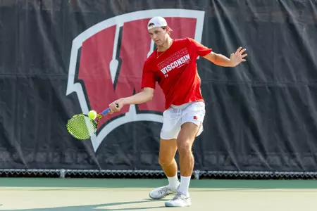 Collin Beduhn returns a serve