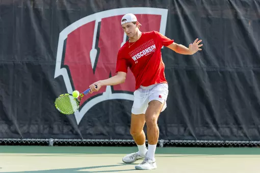 Collin Beduhn returns a serve