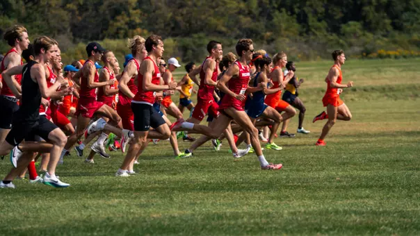 Liam Newhart leads the Badgers off the starting line