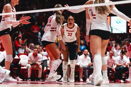 Grace Egan celebrates after winning a point against UC Davis.