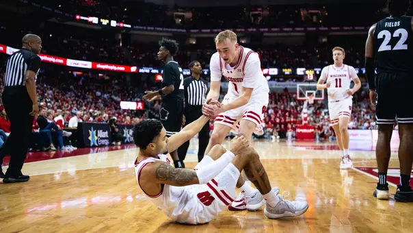 Andrew Rohde lifts Nick Boyd up against UW-Milwaukee