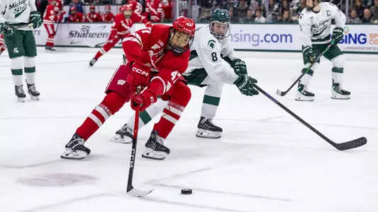 Blake Montgomery possesses the puck at Michigan State