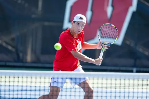 Fullerton returns a serve