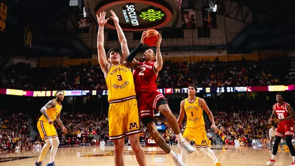 Nick Boyd finishes at the rack against Minnesota