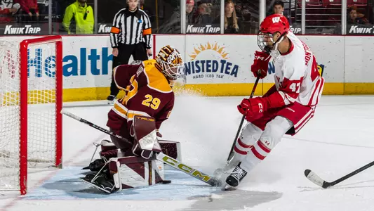 Blake Montgomery takes a shot on the Minnesota goaltender