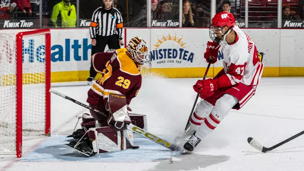 Blake Montgomery takes a shot on the Minnesota goaltender