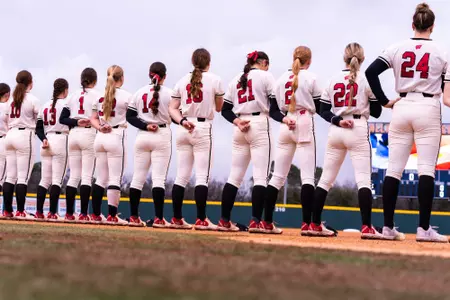 Softball lined up for the National anthem at UTA