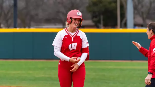 Emily Bojan smiles after a base hit in Texas.