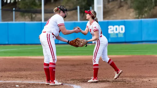 Makenzie Foster and Berritt Herr meet in the circle versus Louisville.