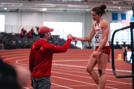 Kyla and Nate big ten championship fist bump