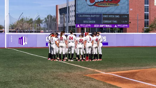 Badgers huddle before playing CBU.