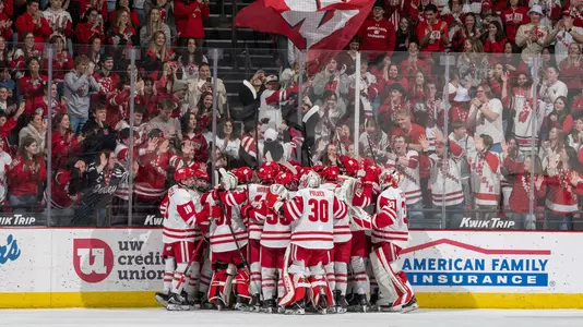 Wisconsin men's hockey celebrating an overtime winner against Notre Dame