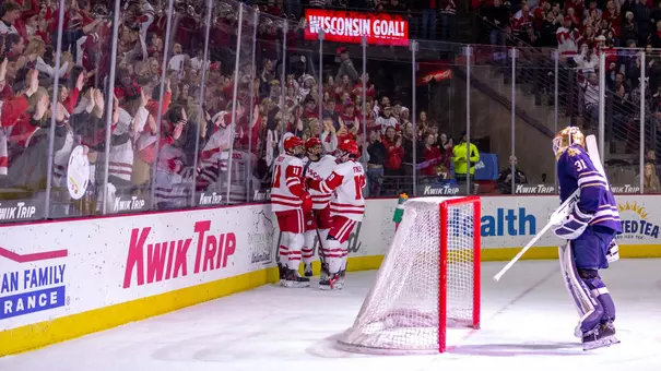 Wisconsin men's hockey celebrates a goal