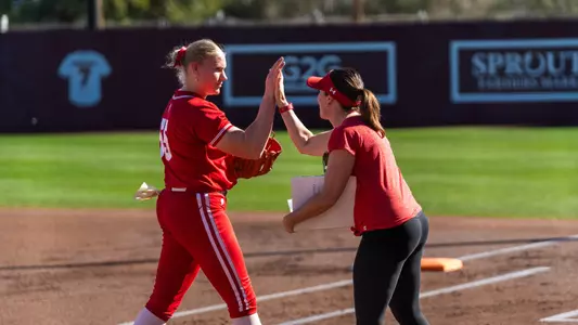 Berritt Herr and head coach Yvette Healy meet at the foul line versus UNLV.