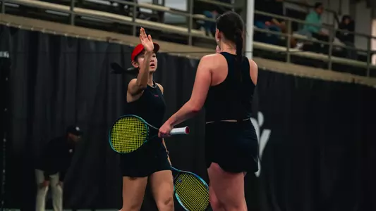 Usui and Sholokhova after winning a doubles match