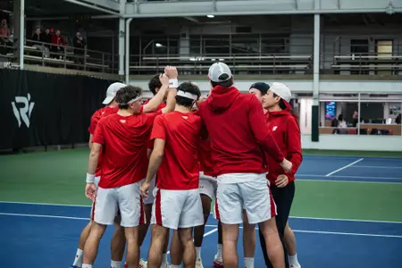 Wisconsin men's tennis huddles before a match