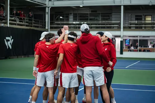 Wisconsin men's tennis huddles before a match