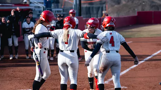 Hilary Blomberg celebrates at home plate after a HR.