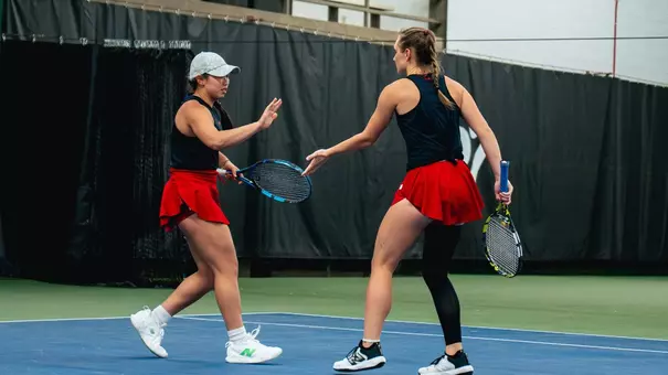 Kaja and Tianna high-five after a point