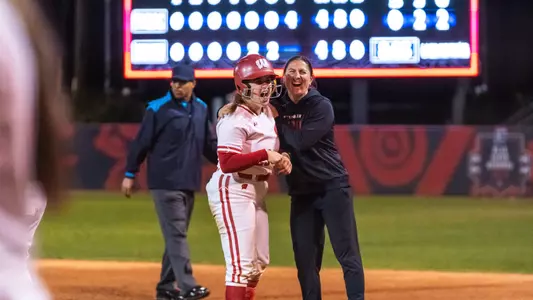 Hilary Blomberg celebrates at first base after an RBI single versus SDSU.