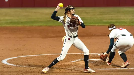 Shelby Jacobson throws to first base against Nebraska.