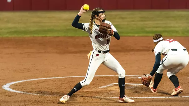 Shelby Jacobson throws to first base against Nebraska.