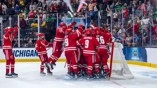 The Wisconsin men's hockey team celebrates going to the national title game