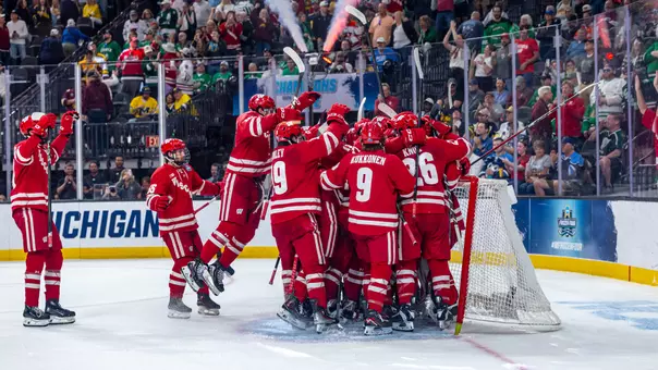 The Wisconsin men's hockey team celebrates going to the national title game