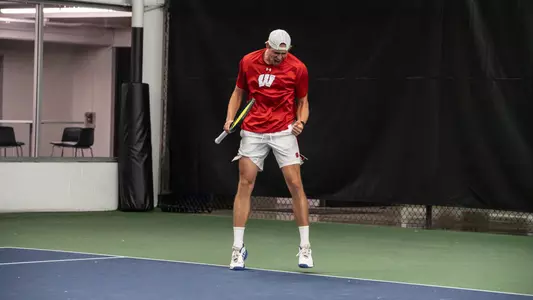 Oliver Olsson celebrates a point in doubles play