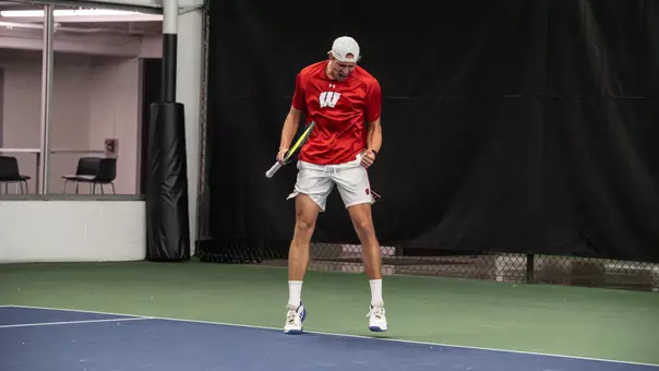 Oliver Olsson celebrates a point in doubles play