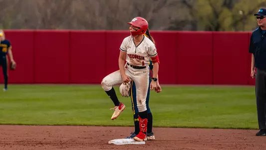 Kaylie Whidden celebrates after hitting a double versus Michigan.