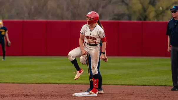 Kaylie Whidden celebrates after hitting a double versus Michigan.