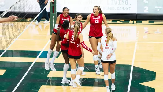 Badgers celebrate after a rally against Green Bay.