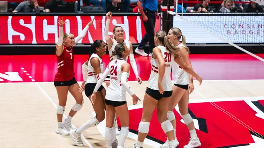 Badgers celebrate after rally versus NIU.