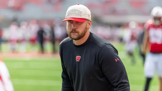 Wisconsin Badgers assistant coach Tuf Borland looks on during warmups prior to a Big Ten Conference NCAA college football game against the Maryland Terrapins, Sat., Sept. 20, 2025, in Madison, Wis. The Terrapins won 27-10. (Photo by David Stluka/Wisconsin Athletic Communications)